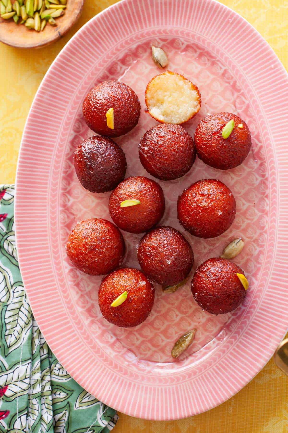 Close Up of gulab jamun with milk powder.