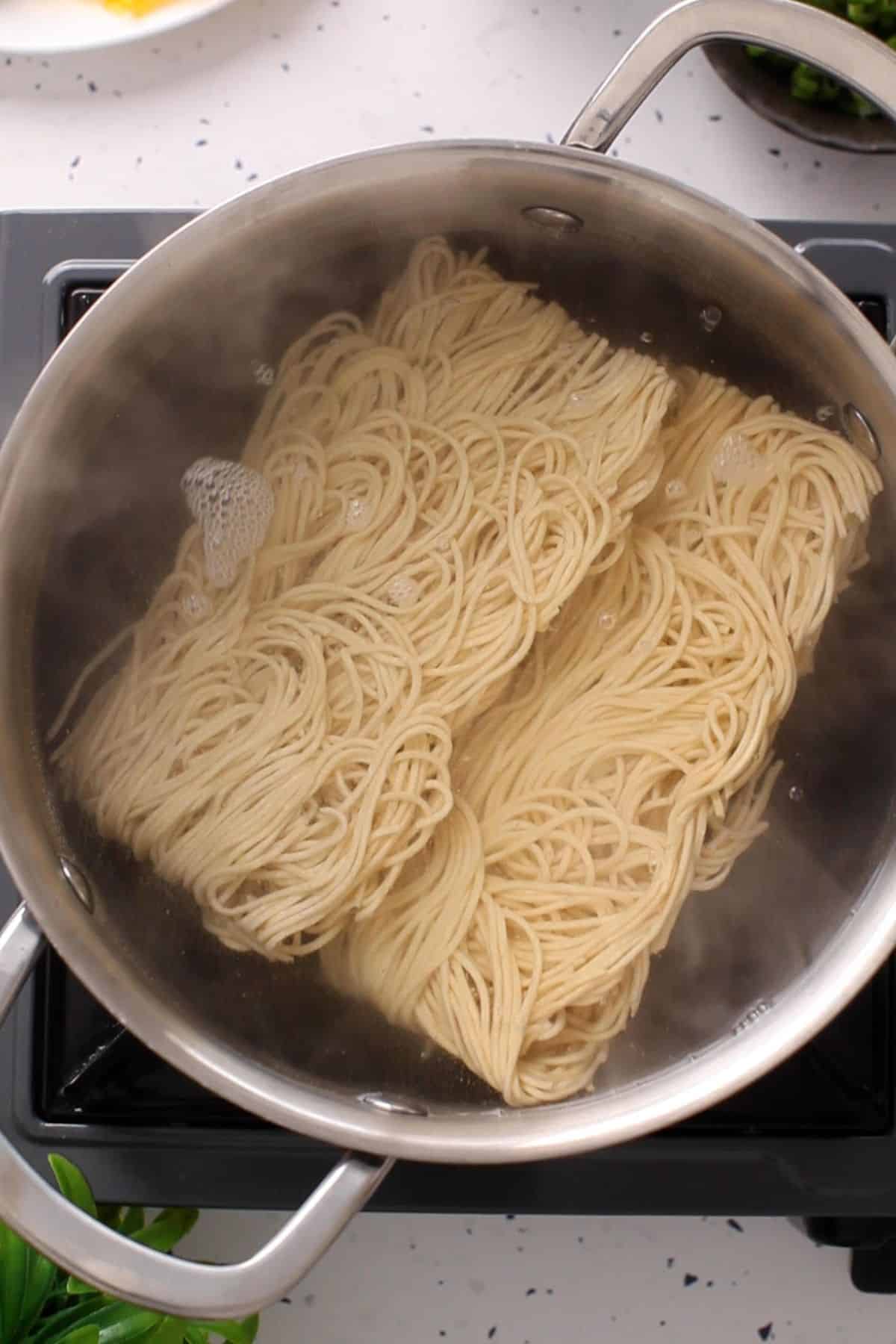 Hakka Noodles are cooked in hot water.
