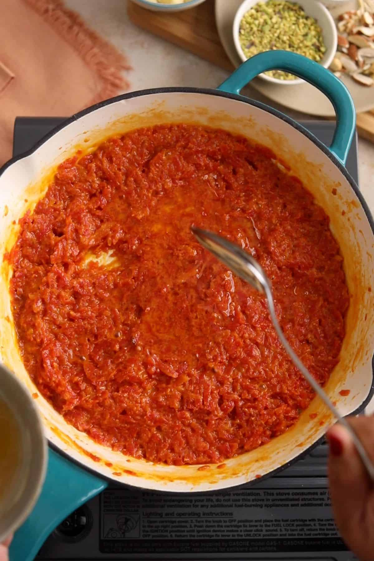 Ghee is added to carrot halwa.