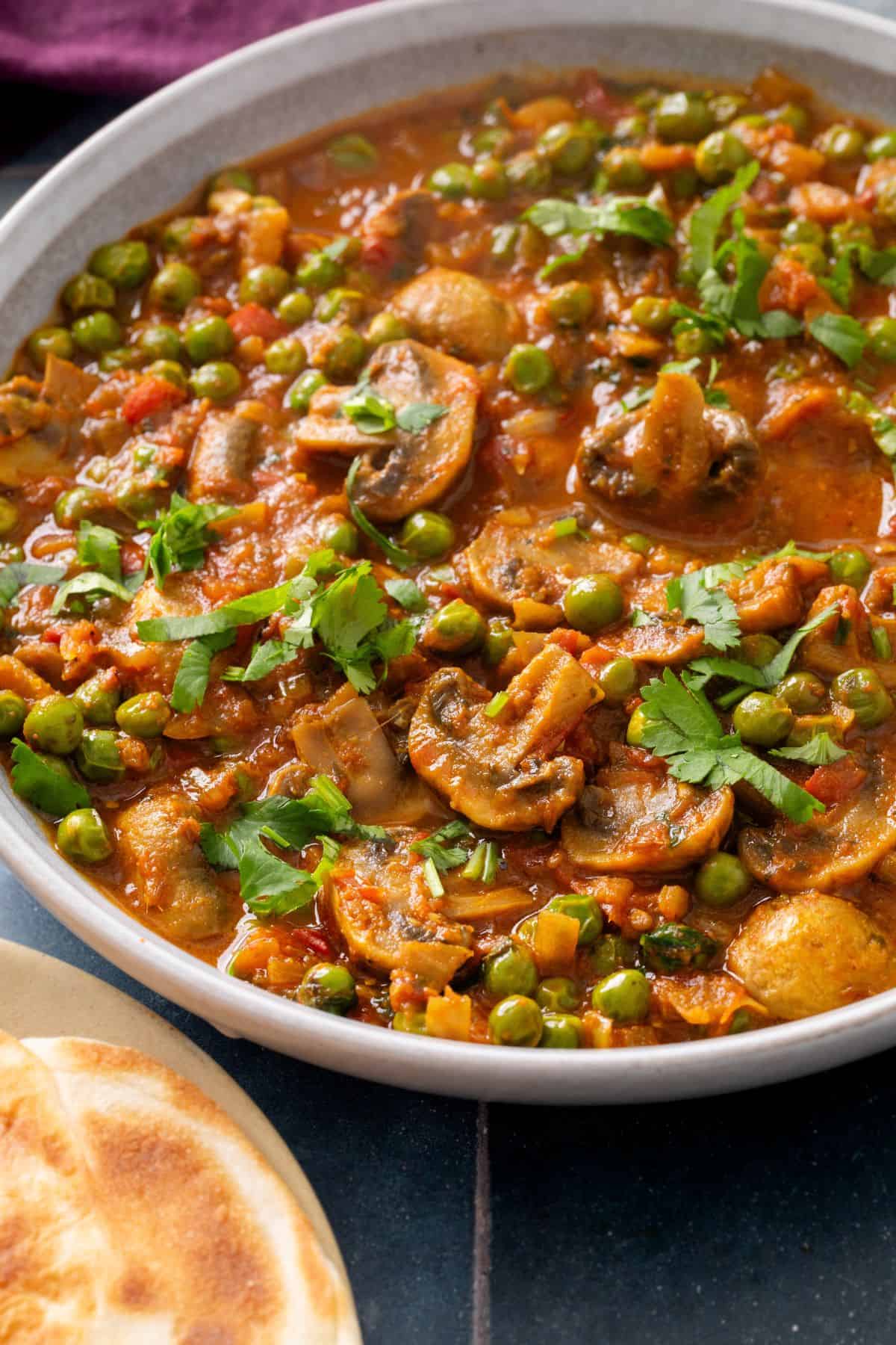 Close up of green peas and mushroom sabzi.