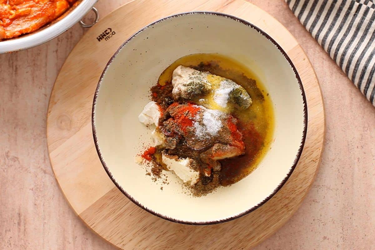 Ingredients for tandoori marinade in an ivory bowl.