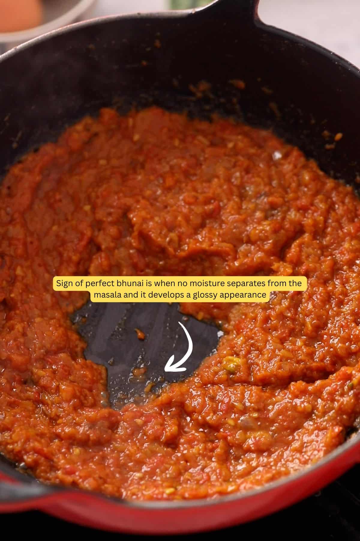 Tomatoes are cooked down until thick and shiny.