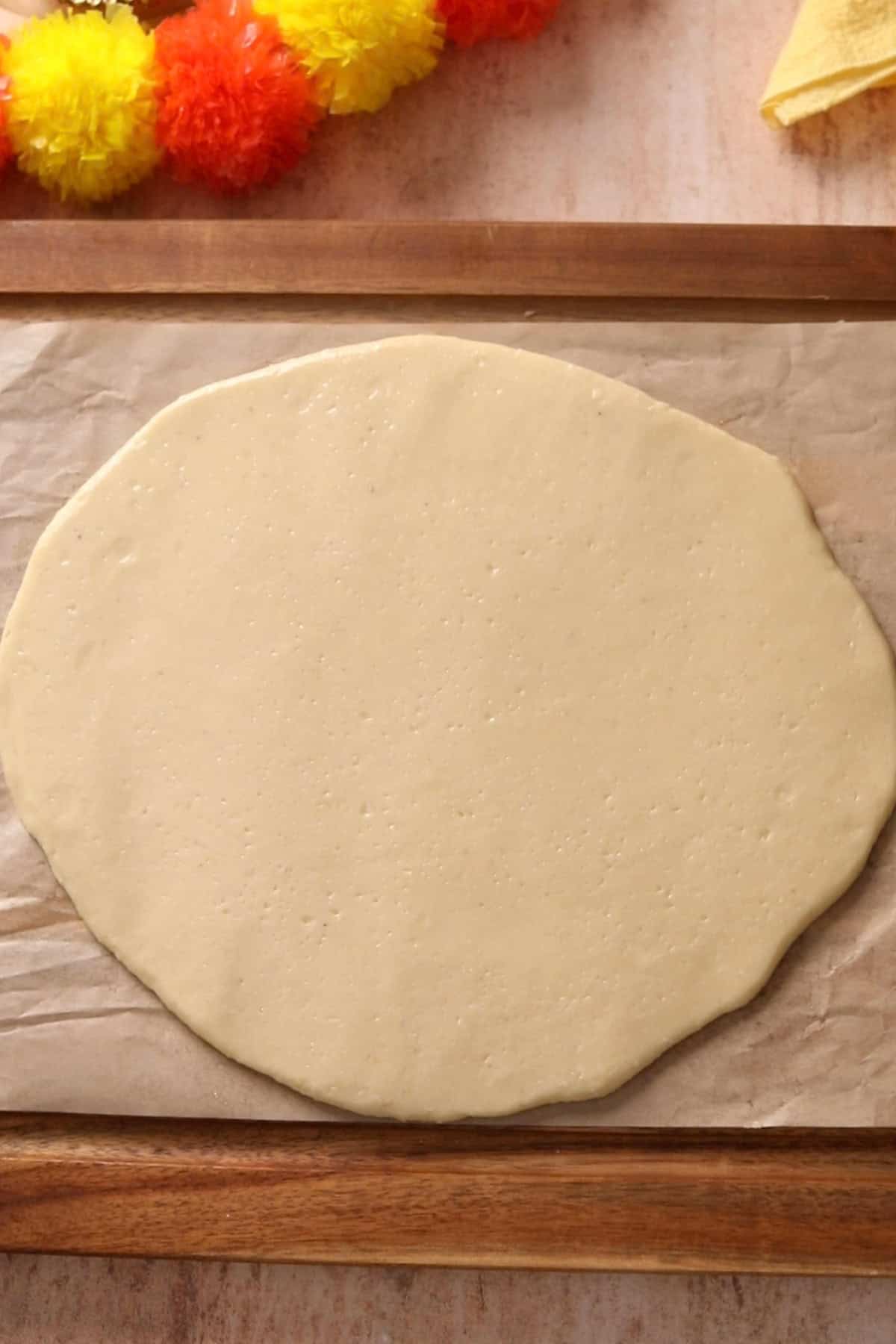 Oval shaped rolled kaju katli dough.