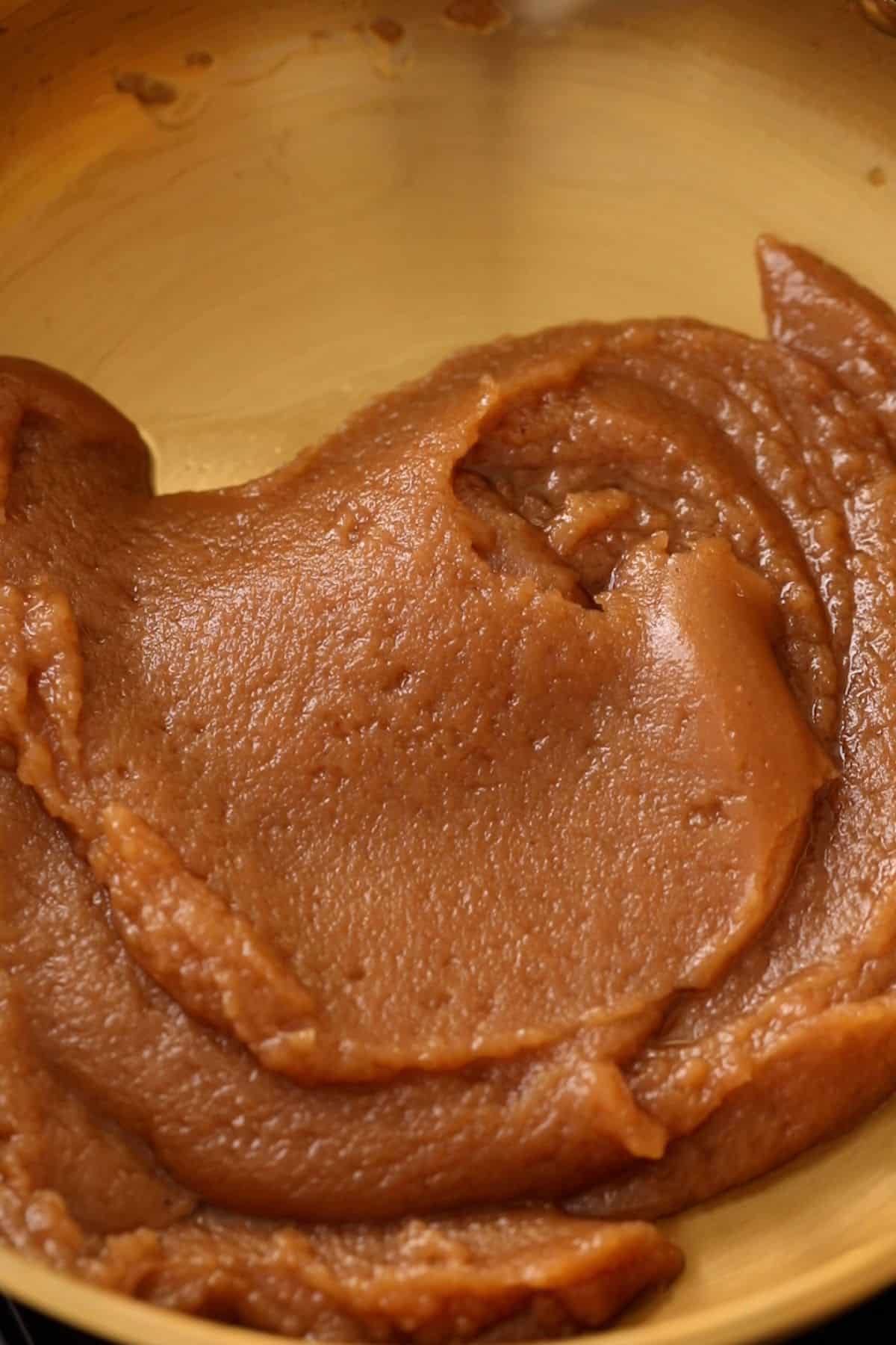 Wheat flour halwa is folded over itself to showcase doneness.