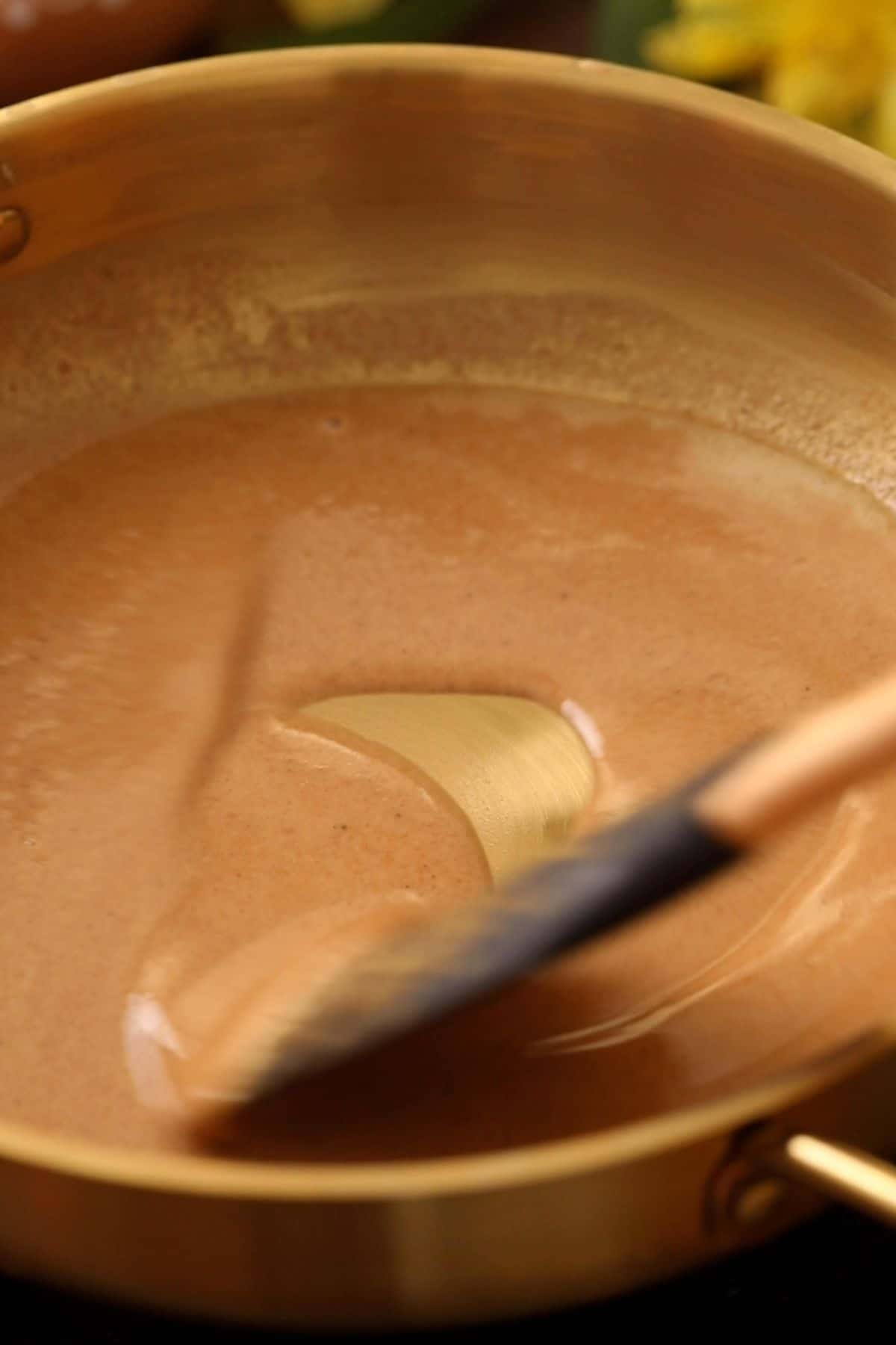 Flour mixture has toasted and acquired a deep brown color.