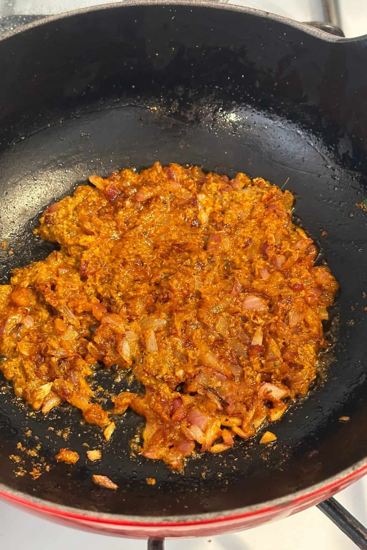 Sauteed onions and spice paste. 