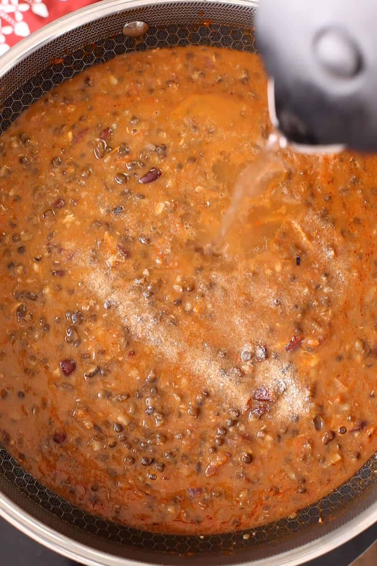 Adjust salt & water in dal.