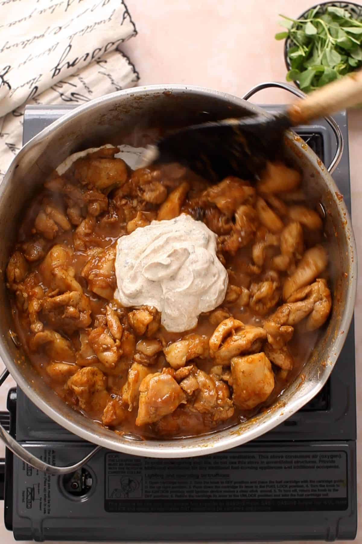 Yogurt is added to the chicken.