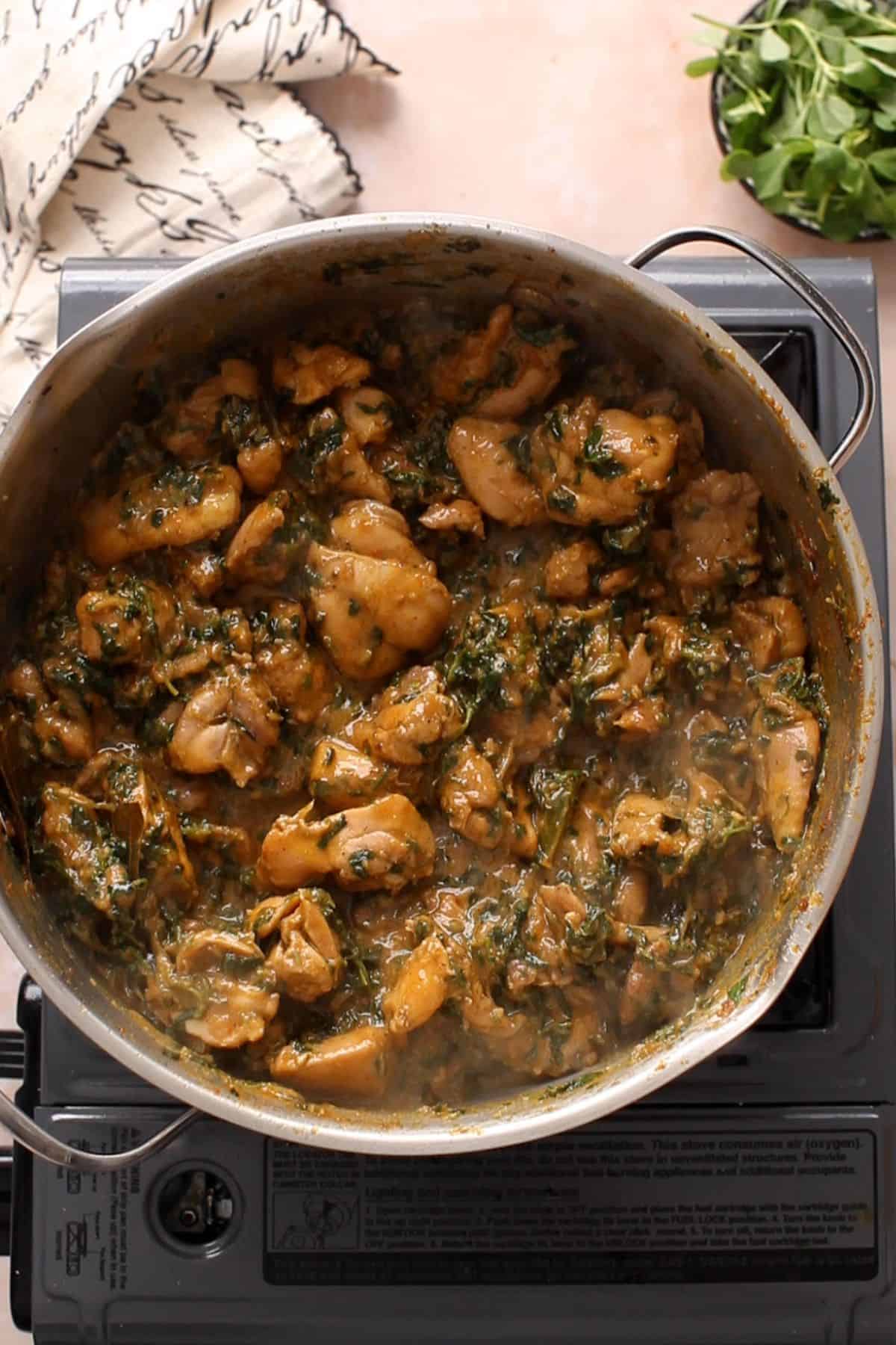 Methi is cooked with chicken until its wilted and forms part of masala.