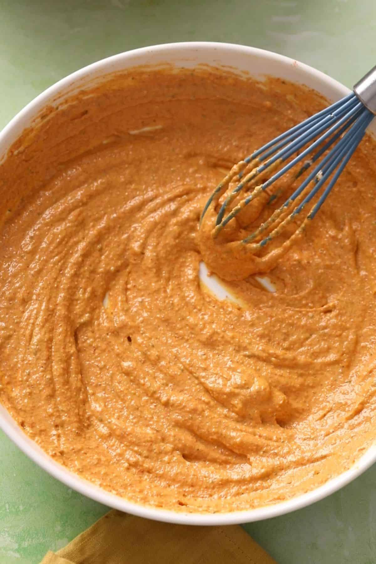 Orange colored tandoori marinade is ready.