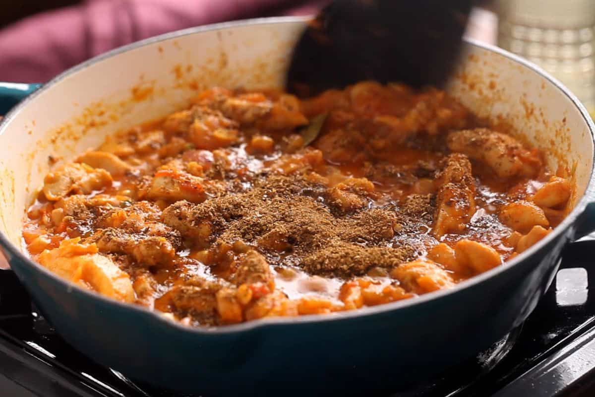 Homemade made tawa masala powder is added to the tawa.