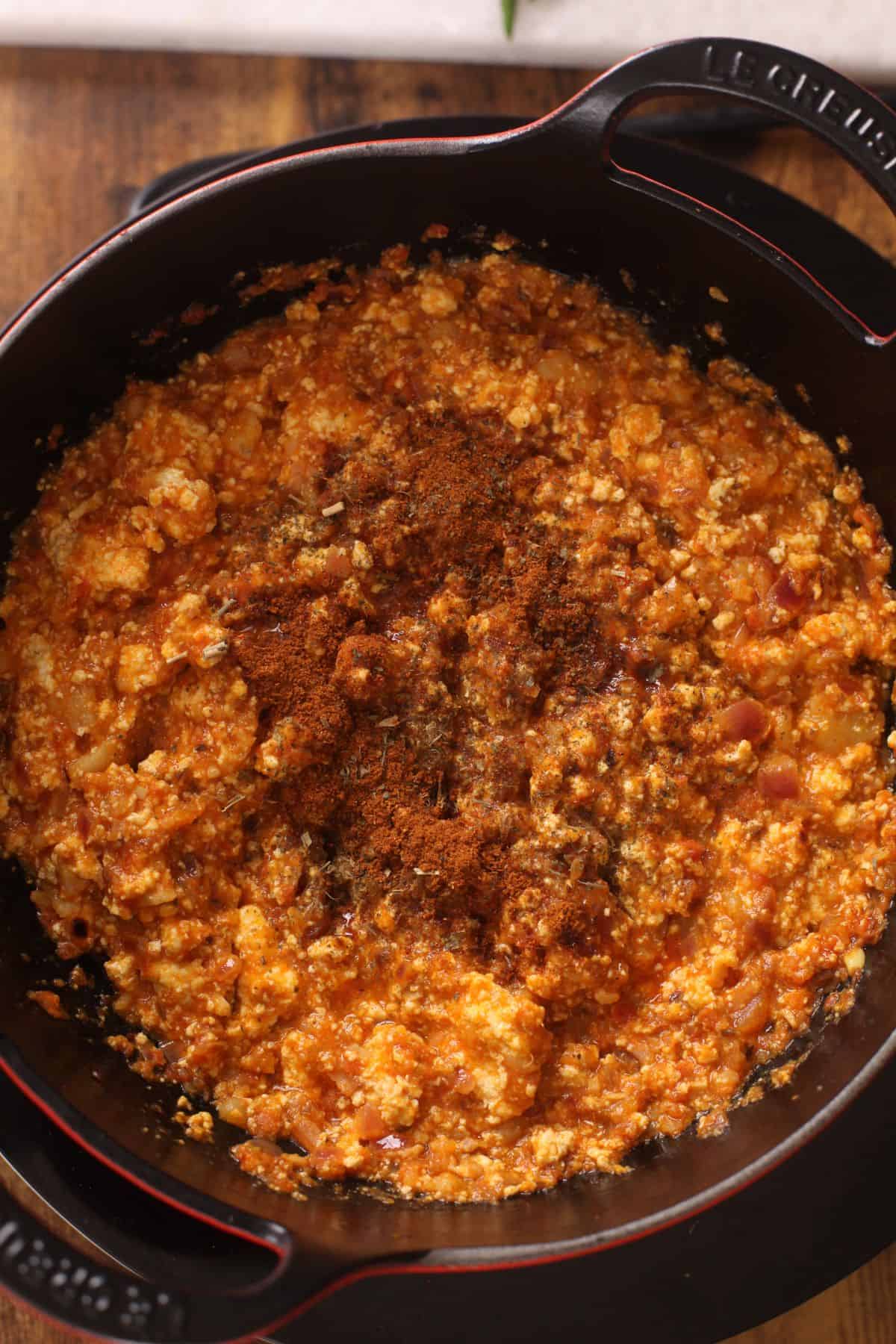 Finishing spices are added to the paneer bhurji.