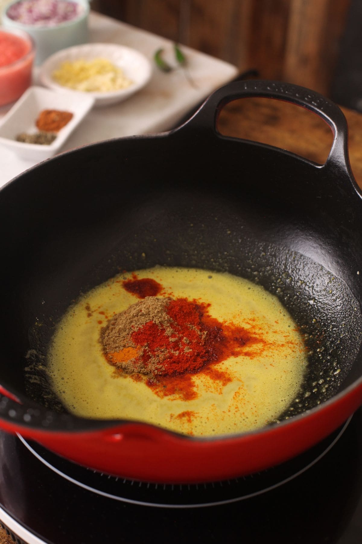Ground spices are added to the gram flour.