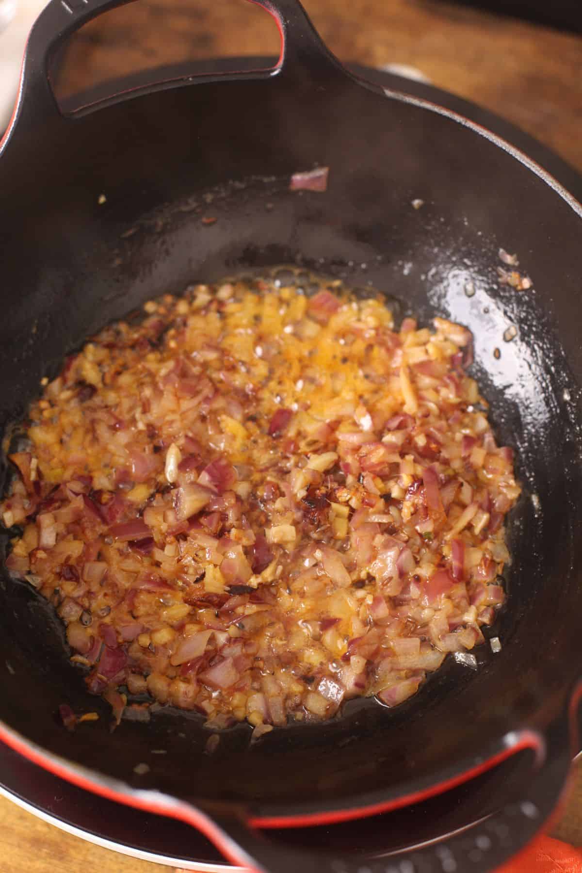Browned onions in the cast iron kadai.