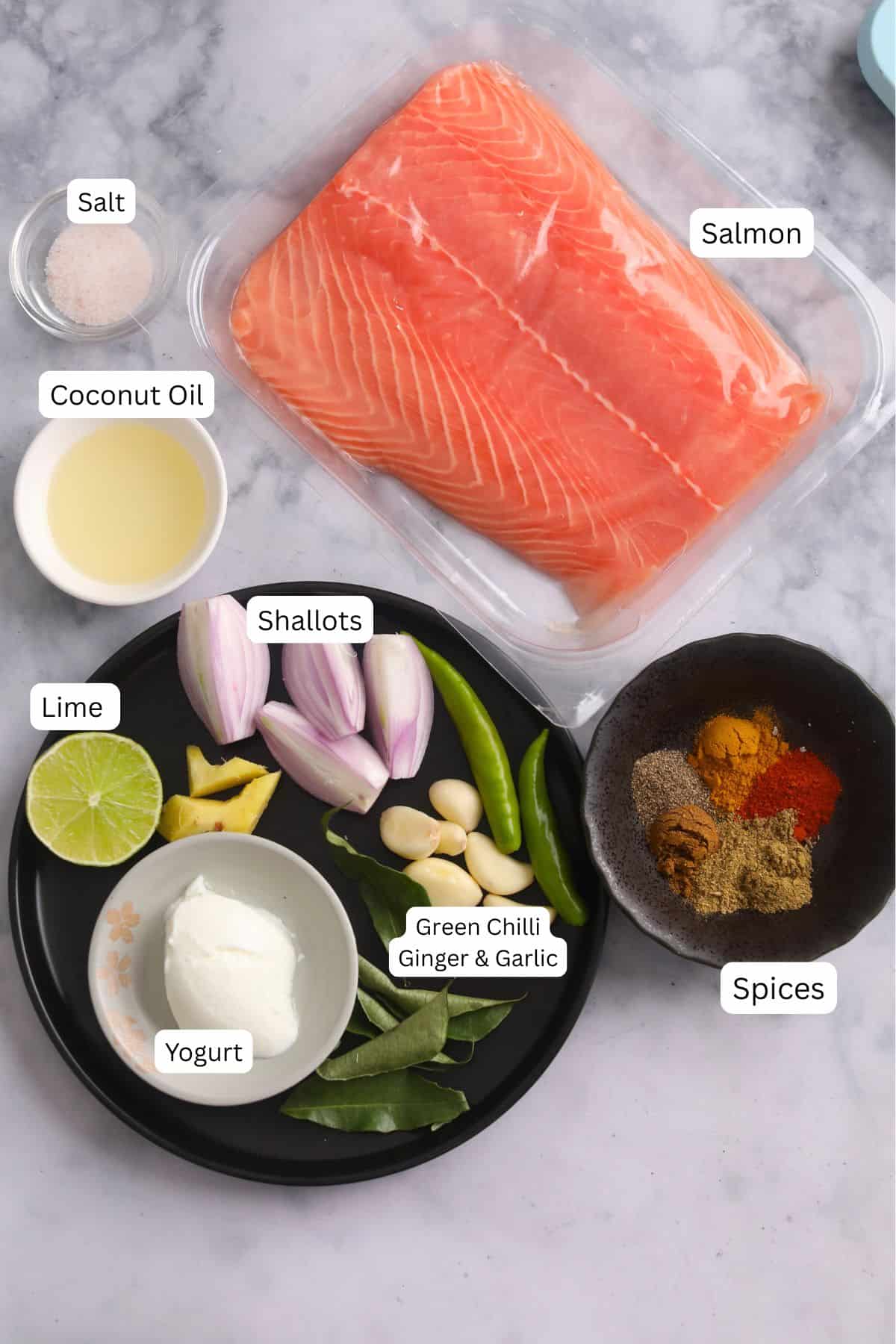 Ingredients Needed To Make Spicy Baked Salmon place on a marble surface.
