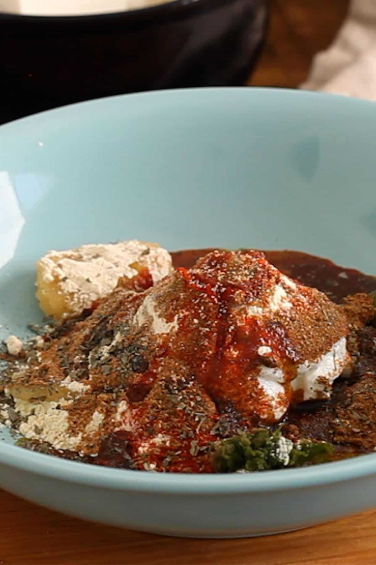 Tandoori Marinade Ingredients are placed in a light blue shallow bowl.