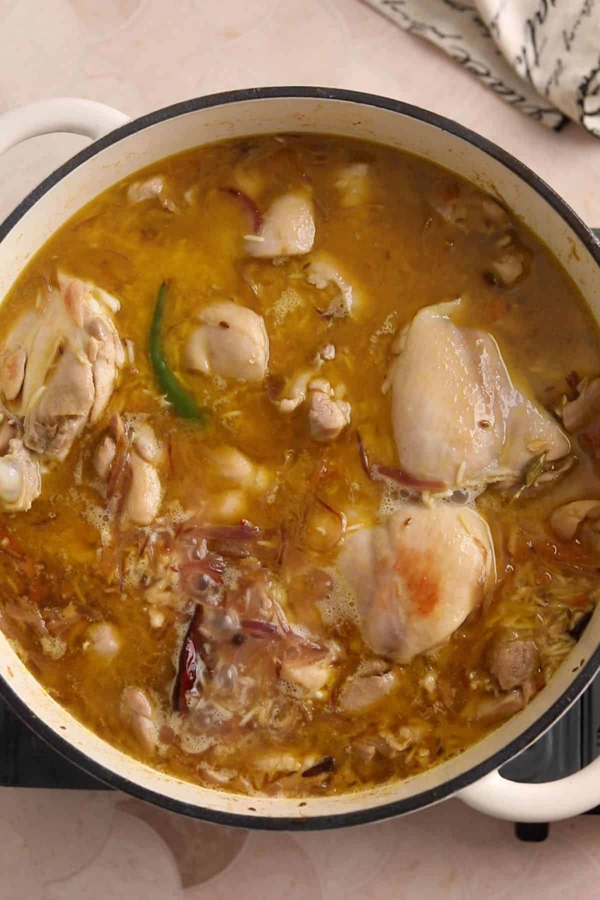 Bring rice and water to slow bubbling.