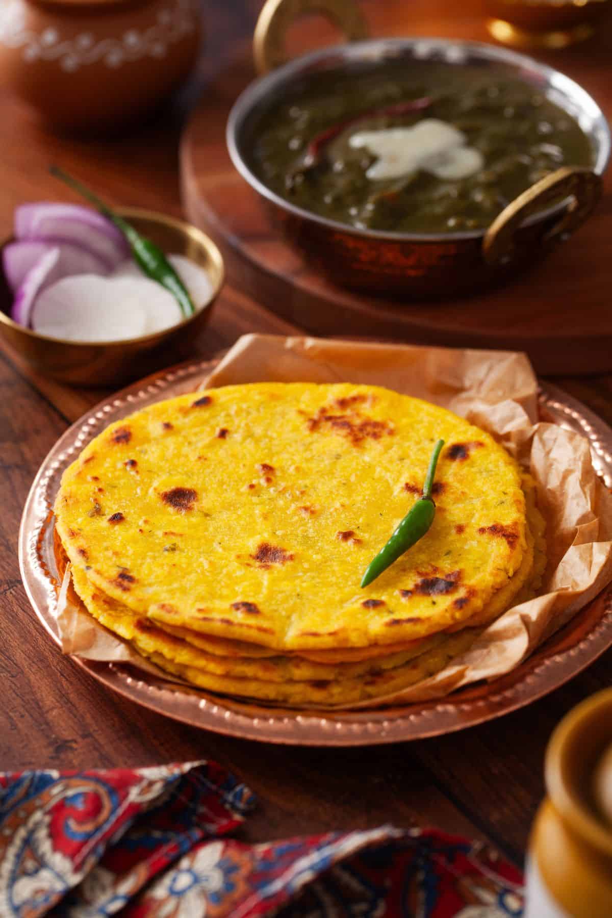 Makki Ki roti served with mustard greens curry.