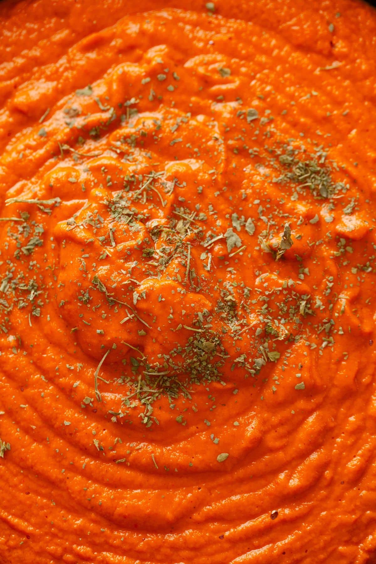 Close up of butter chicken simmer sauce.