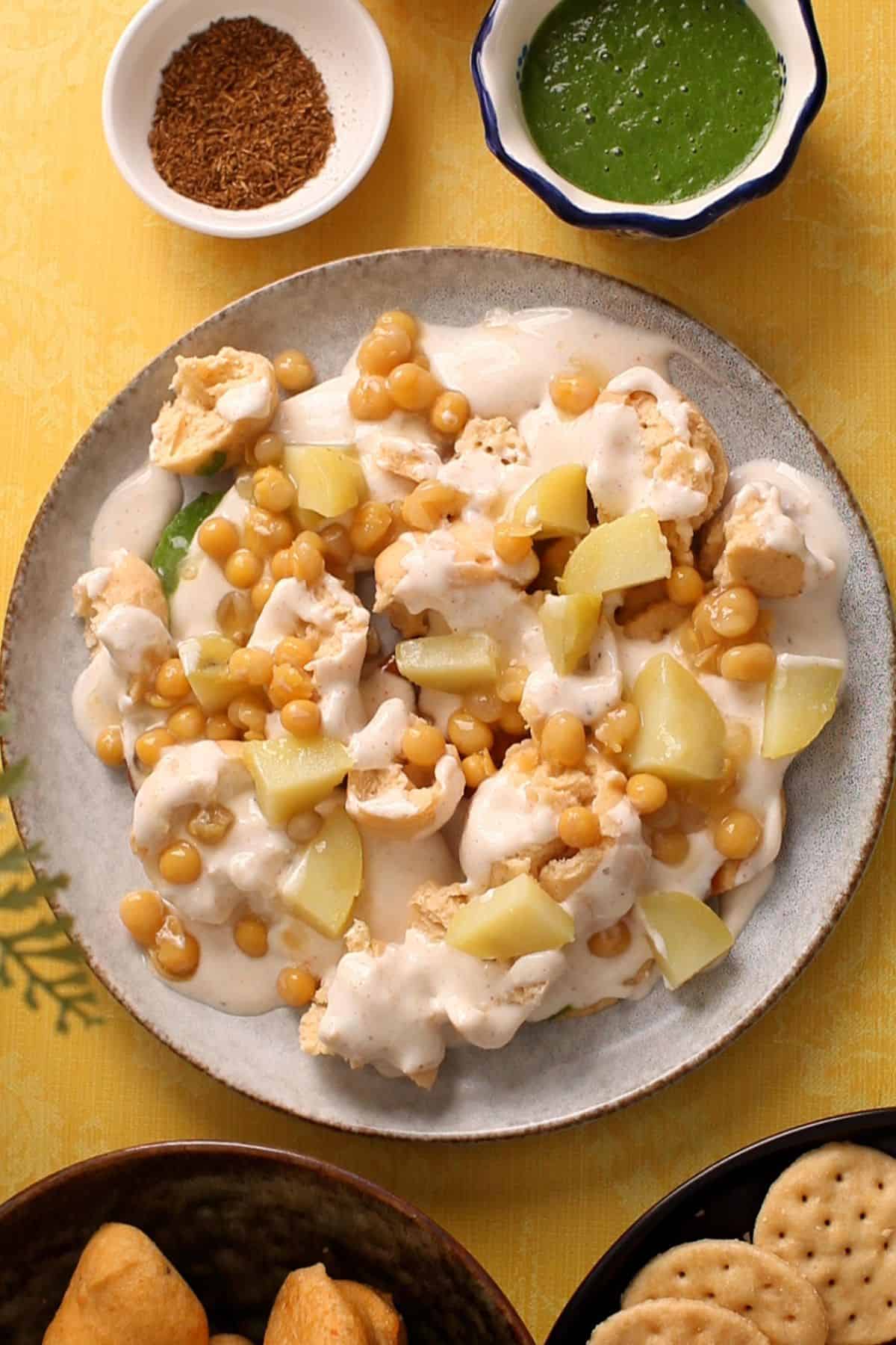 Yogurt, potatoes and boiled white peas are added to the chaat.