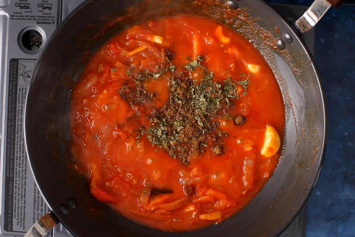 Once tomatoes are soft, add dry fenugreek leaves and garam masala.