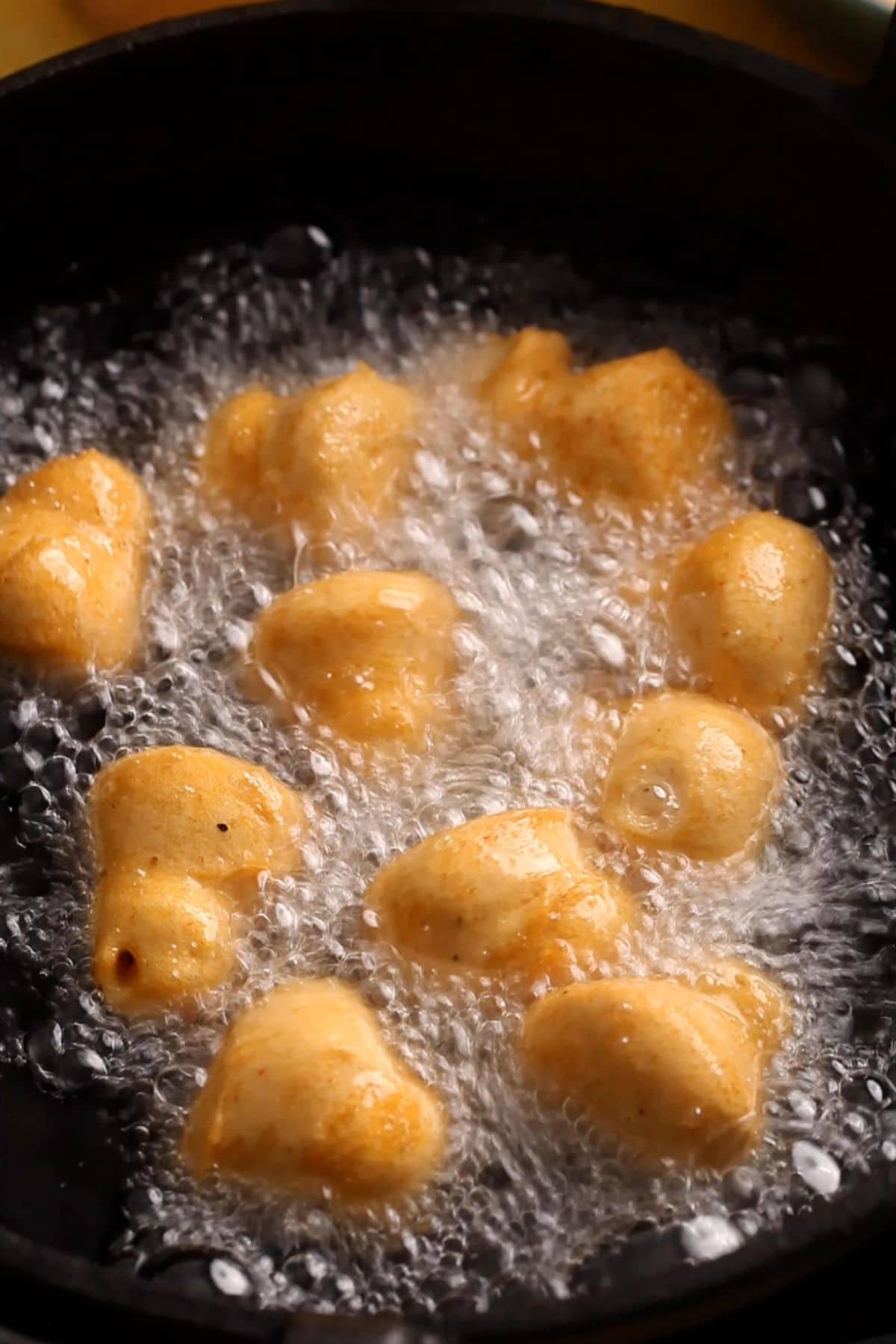 Bhalla are deep frying in hot oil.