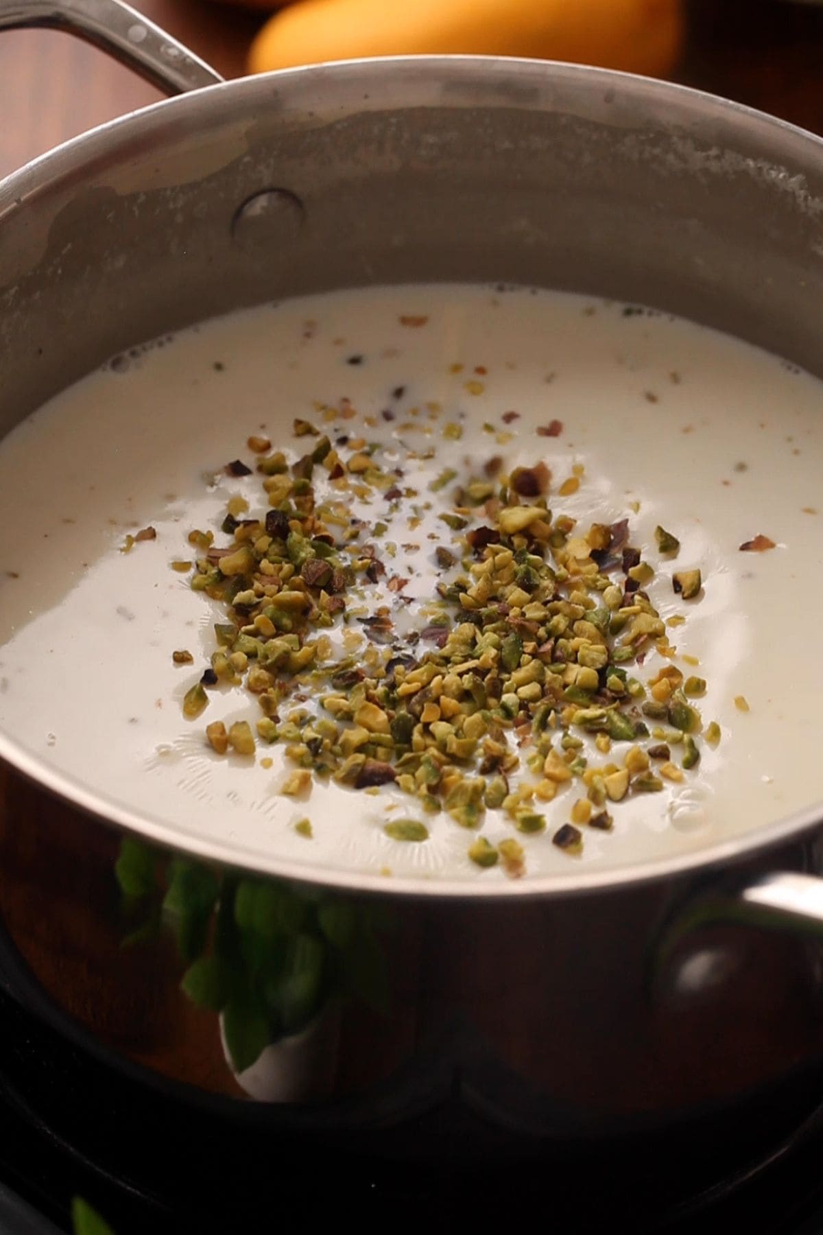 Sprinkle the crushed pistachios over kheer.