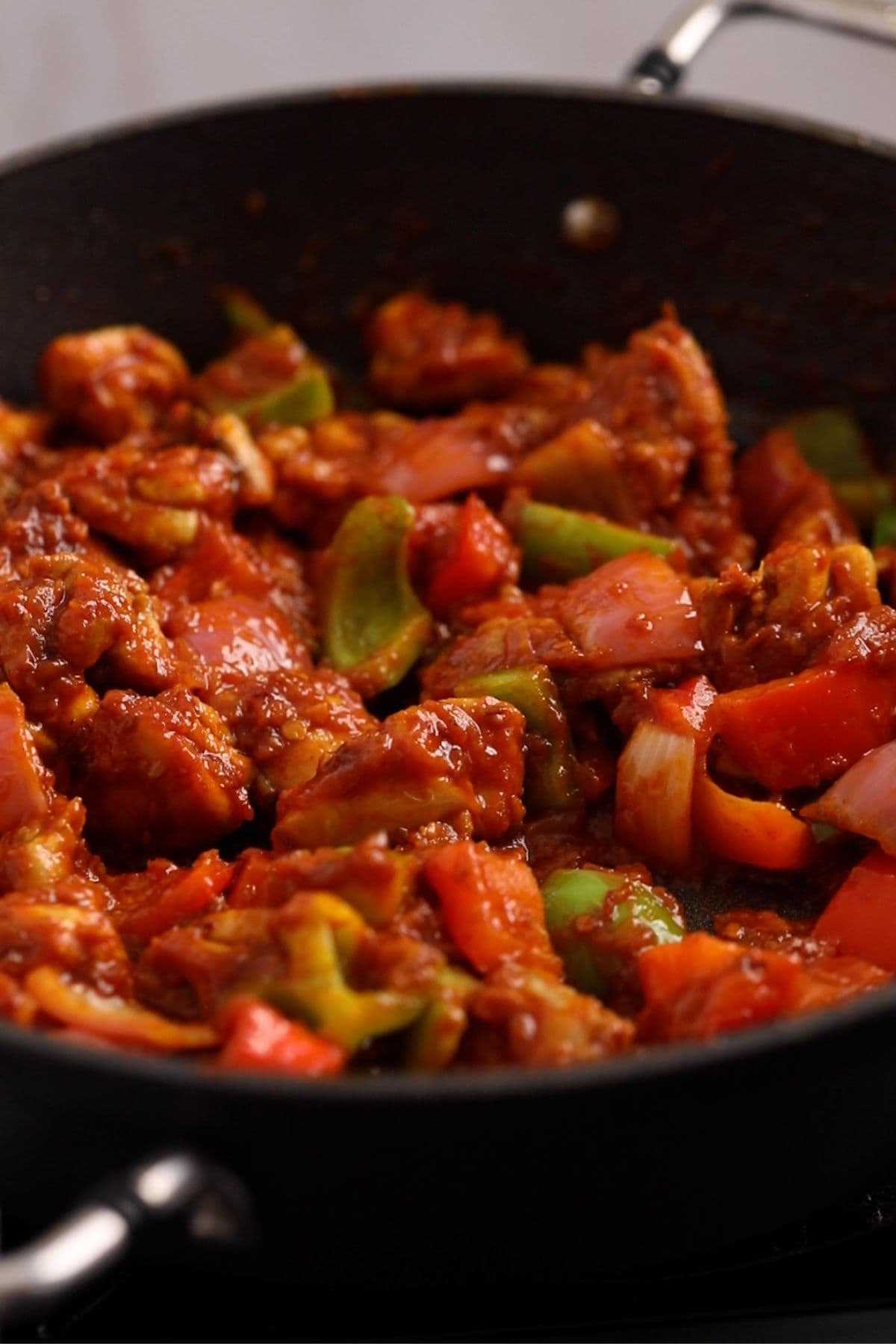 Chicken and bell peppers are mixed.