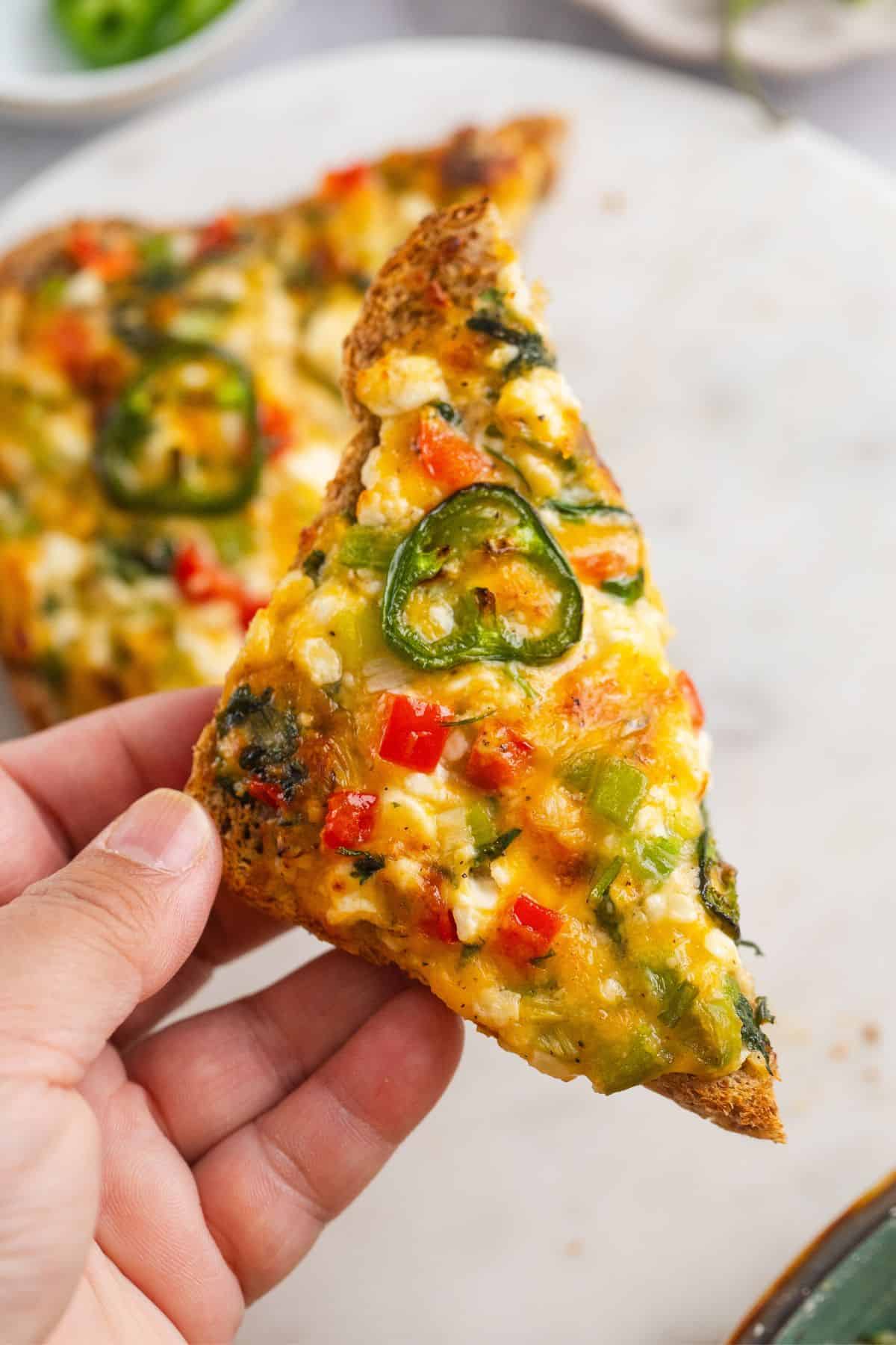 15-Minute Cottage Cheese Chilli Toast 5 Cottage cheese chilli toast half picked in hand.