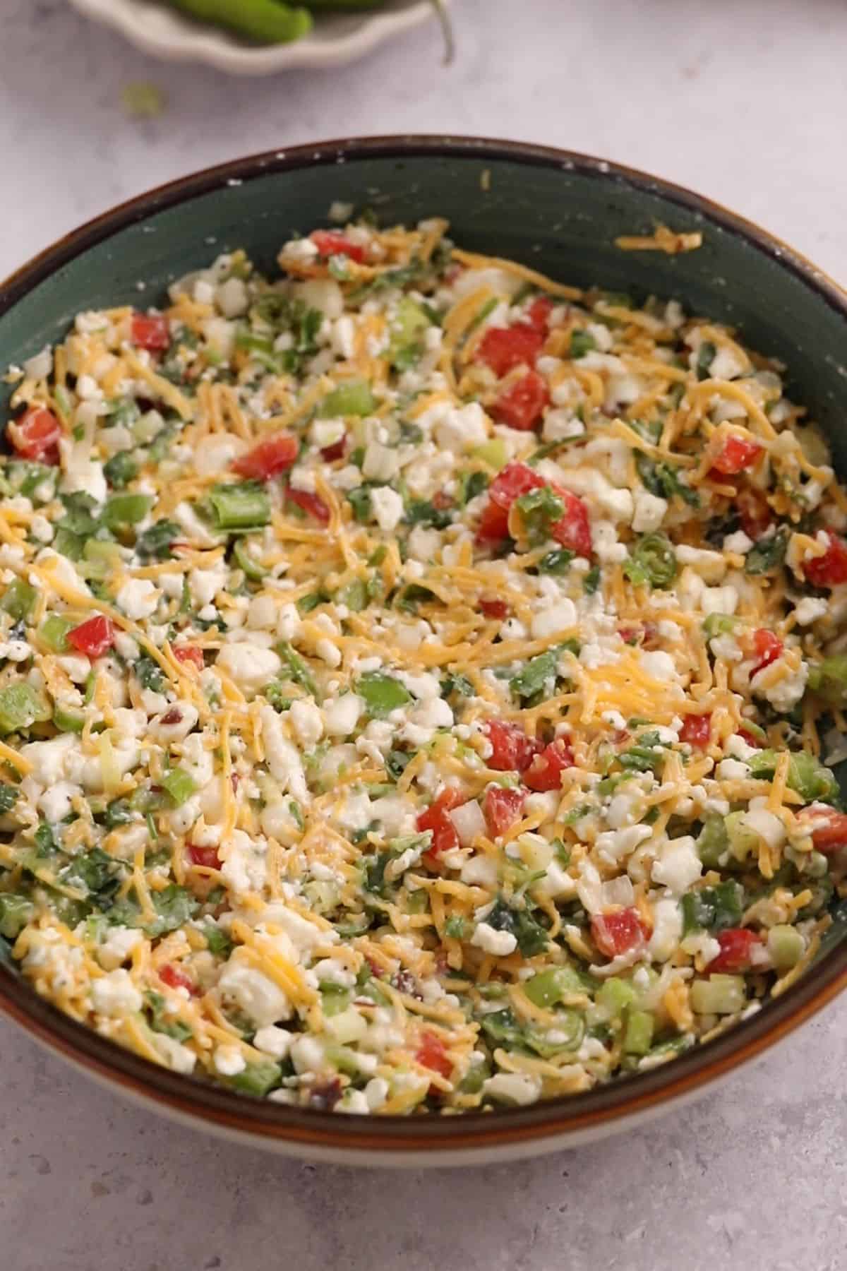 15-Minute Cottage Cheese Chilli Toast 9 Chilli Cheese toast mixture in a blue bowl.