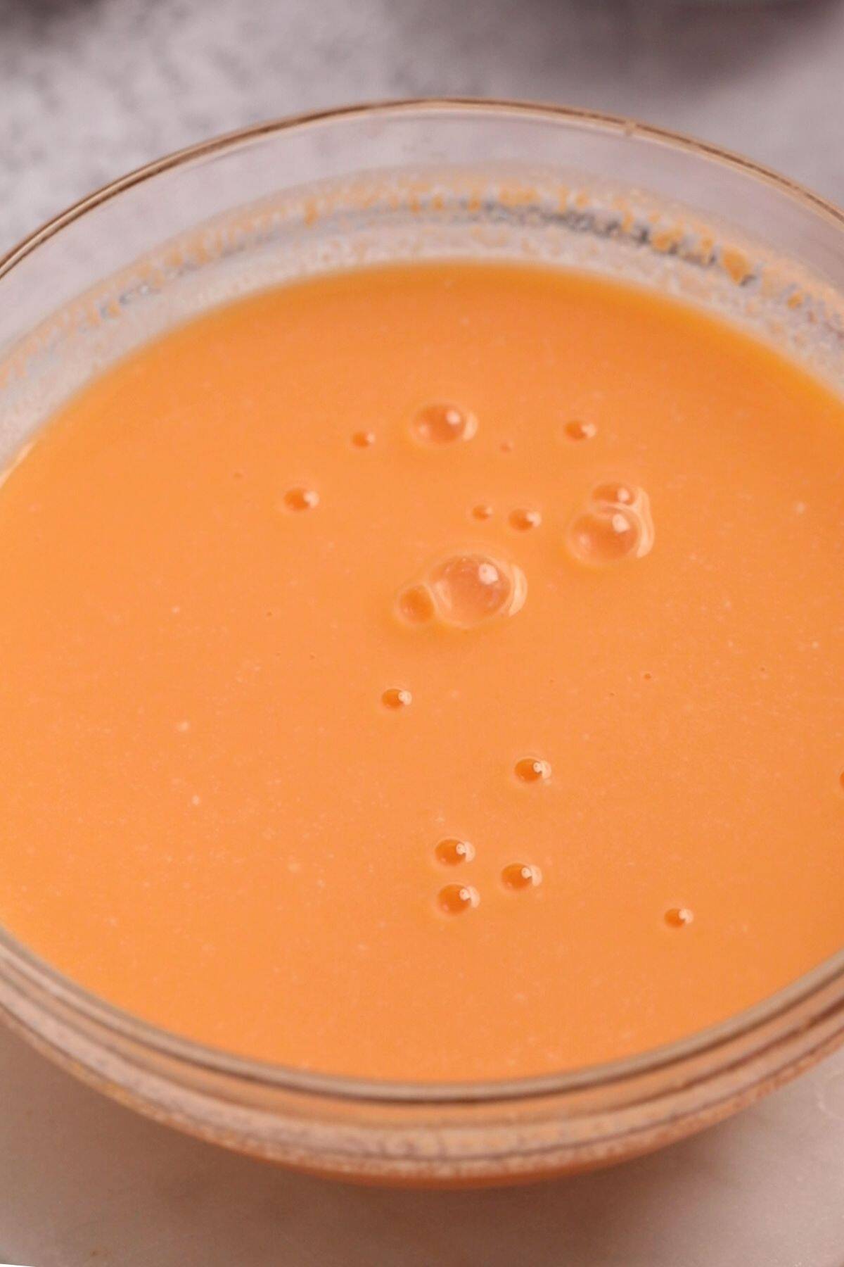 Orange jelly mixed with yogurt.