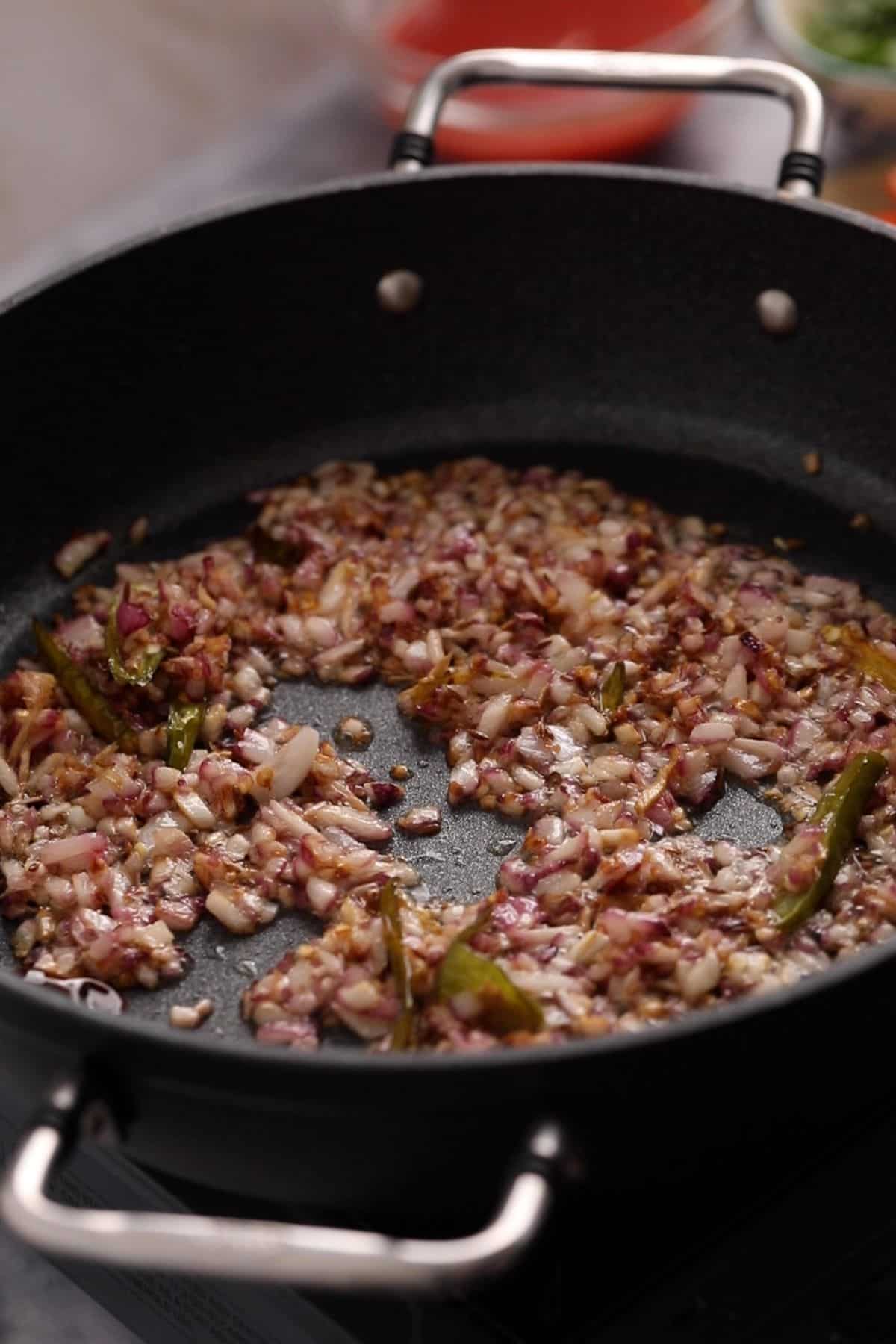 Browned chopped onions in the black skillet.