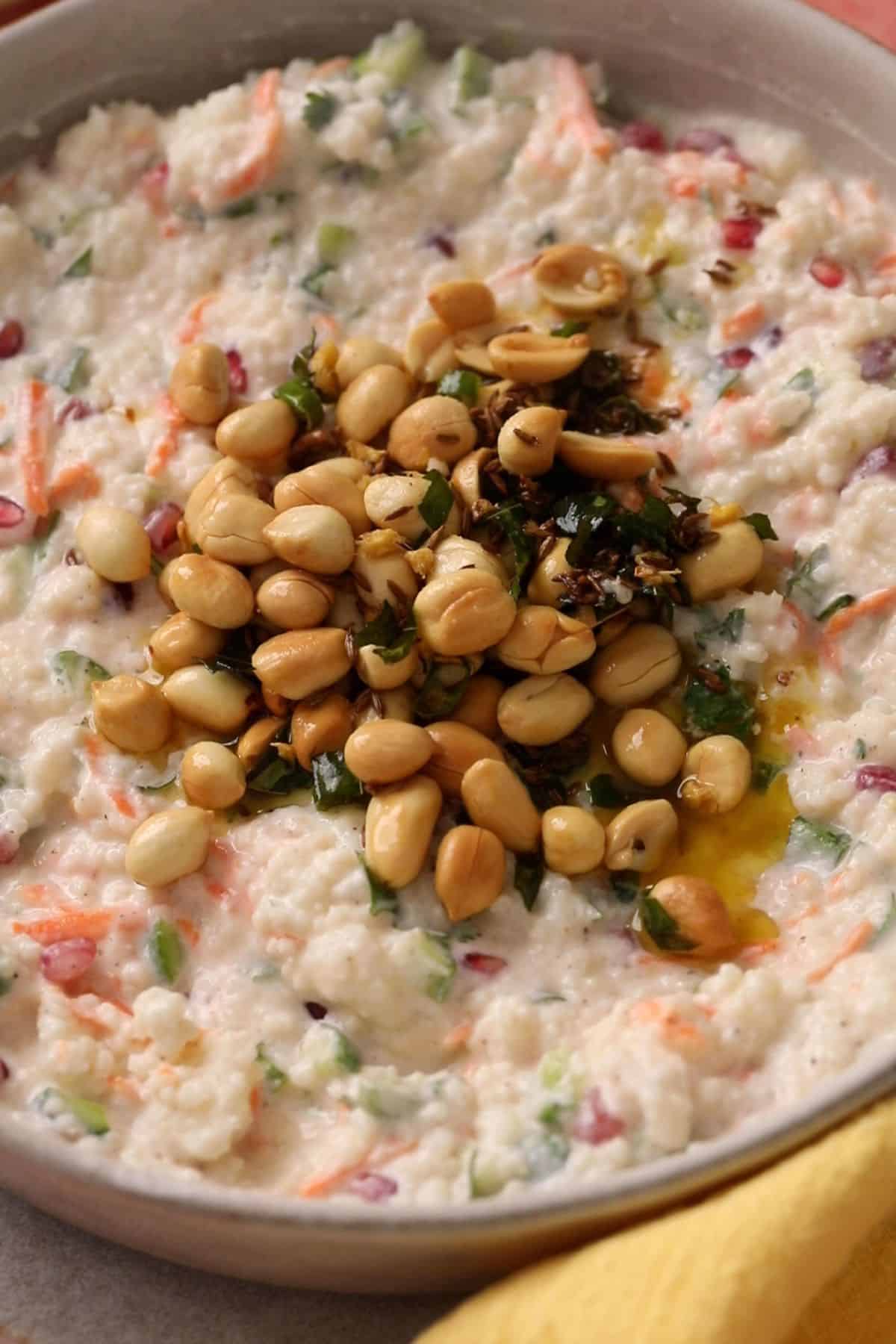 Curd Rice With Millets (Fasting Friendly) 15 Tempering is poured over yogurt samo rice.