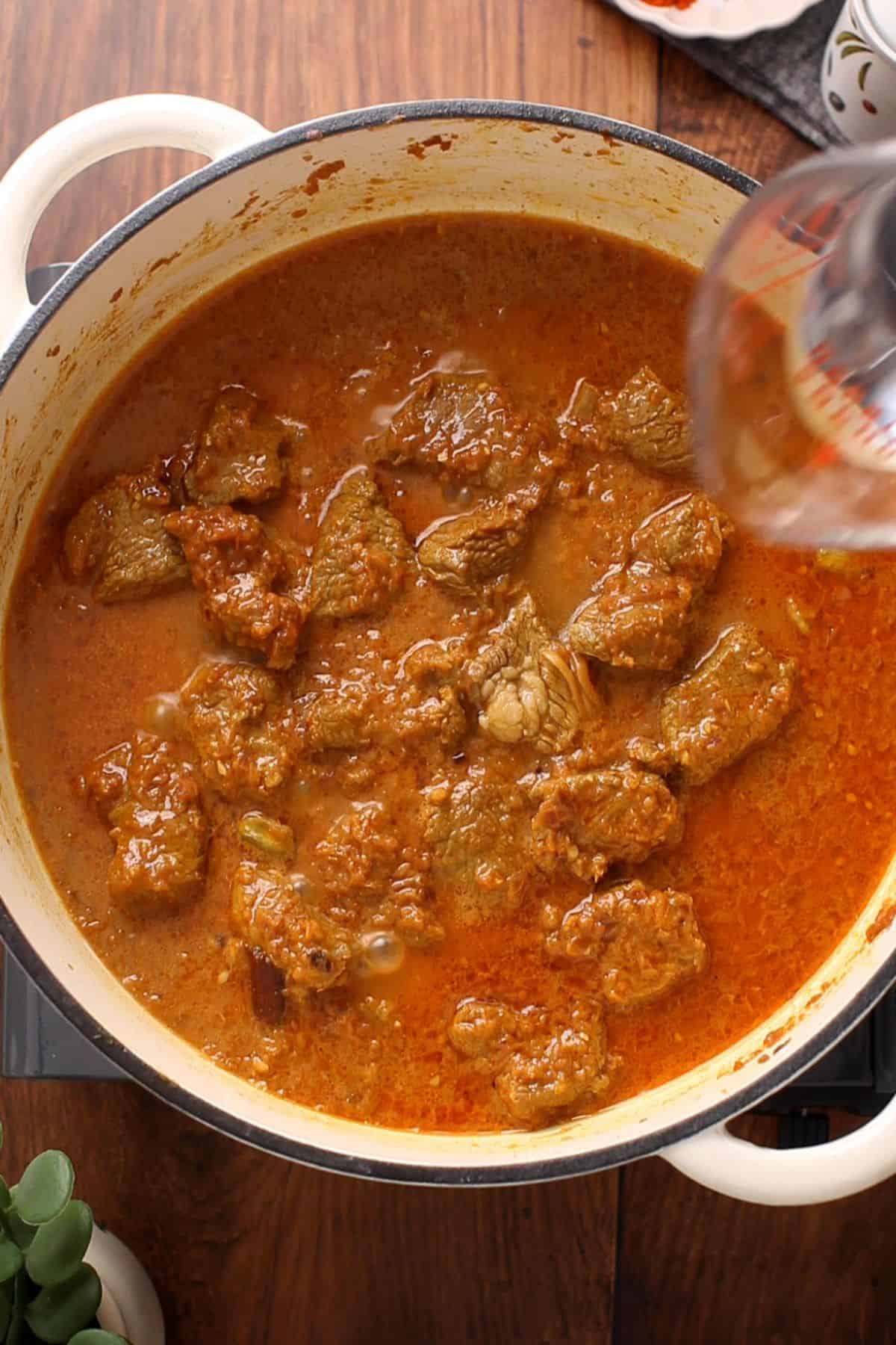 Restaurant-Style Lamb Korma (Rich & Creamy) 24 Hot water is added to the lamb.