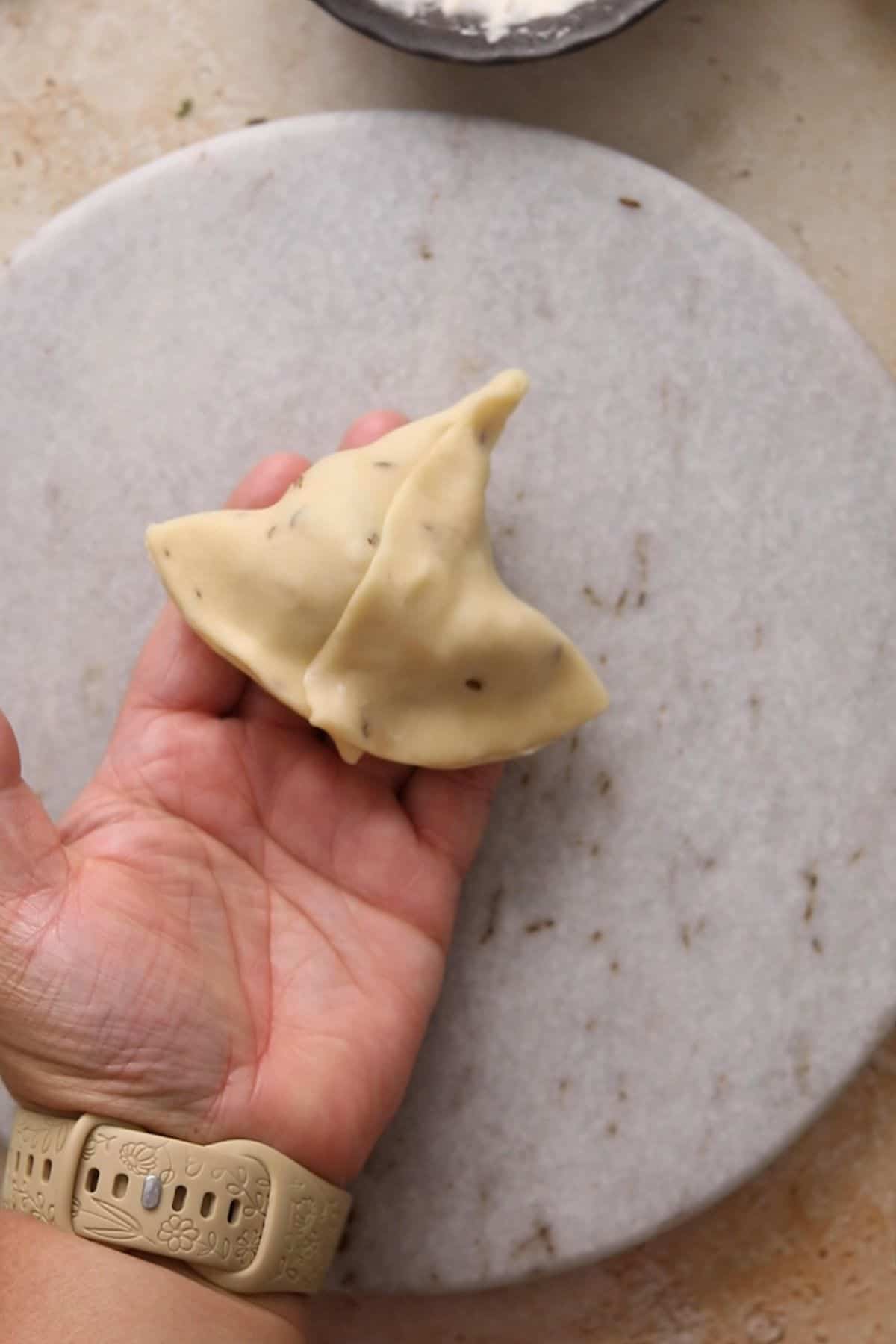Classic Punjabi Samosa Recipe (Crispy & Flaky) 35 Samosa is shaped and looks like a triangle.