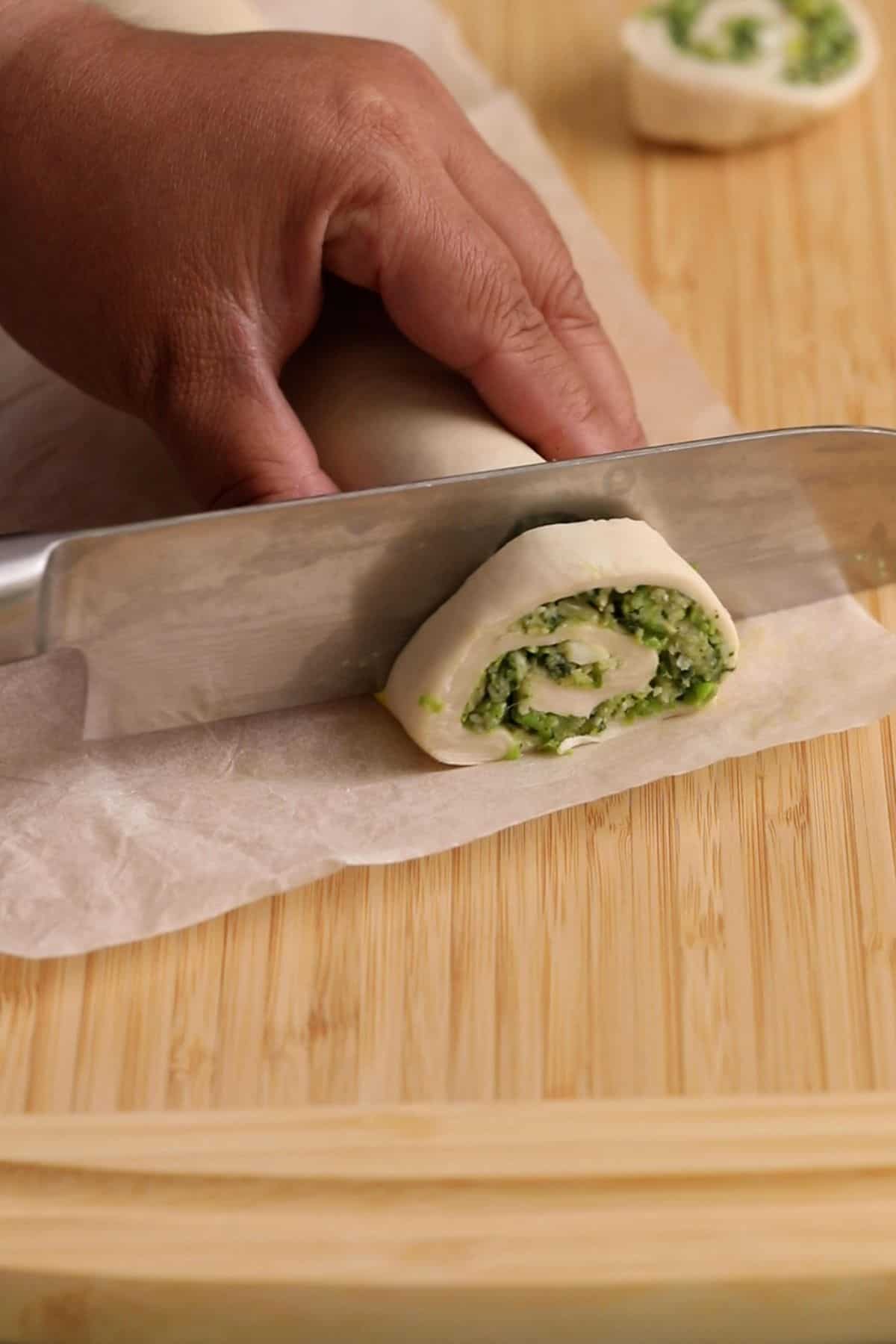 Hara Bhara Kabab Pinwheels - Sinfully Spicy 24 pinwheels are cut using a knife.