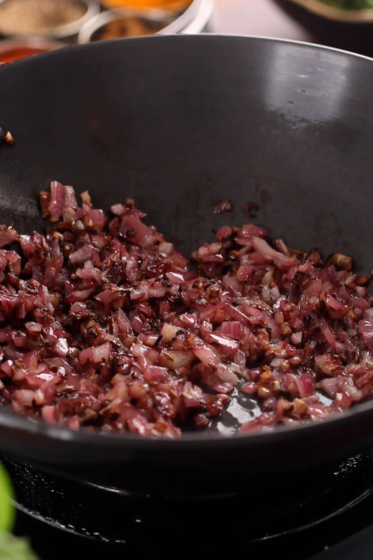 Browned onions in the kadai.