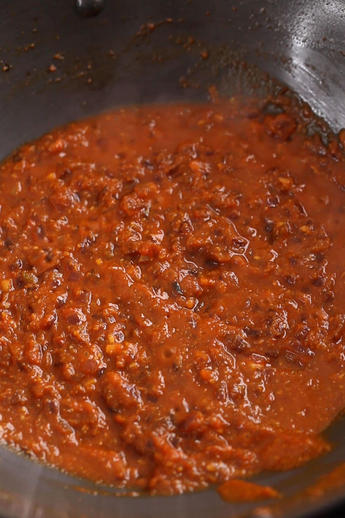 Masala is fried until small ghee bubbles start appearing on the top.