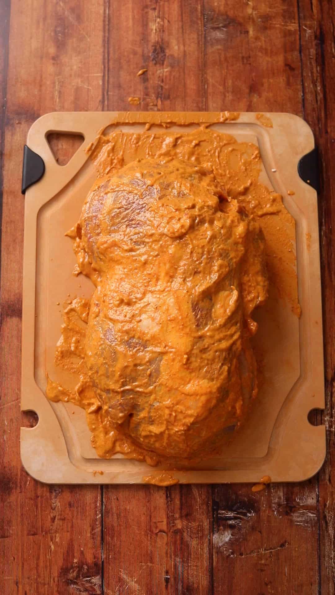 Lamb meat is marinated and tucked in for even roasting.