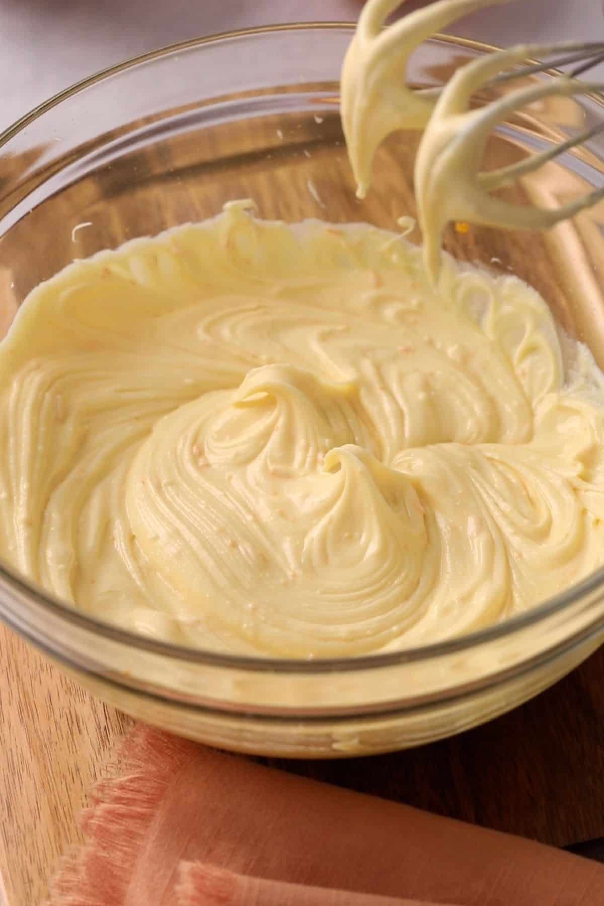 Cream cheese and orange curd mixture is mixed until super smooth.