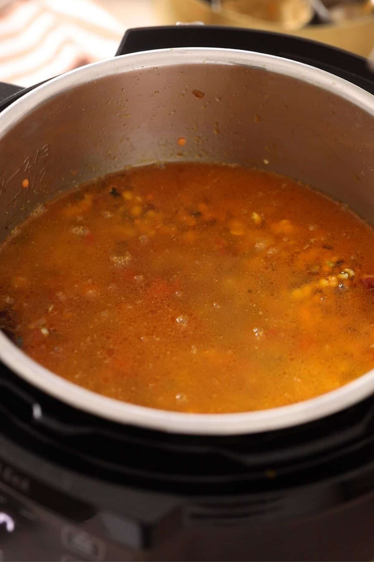 Water is added to the dal in instant pot.