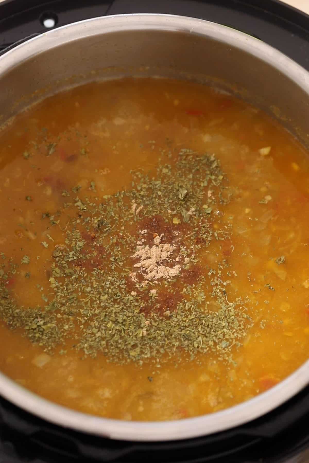 Cooked panchel dal is finished with herbs and spices.