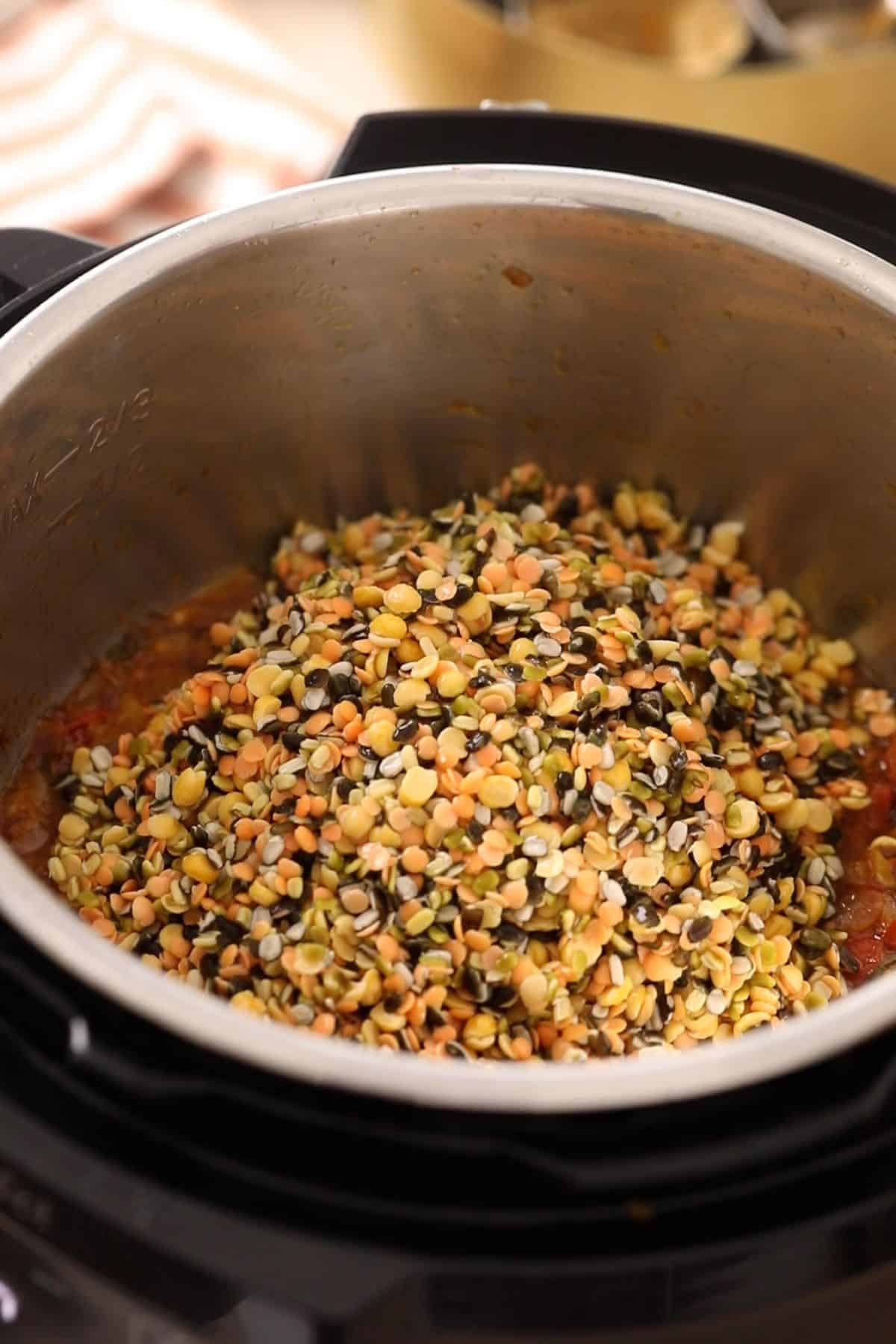 Soaked lentils are added to the onion tomato masala.