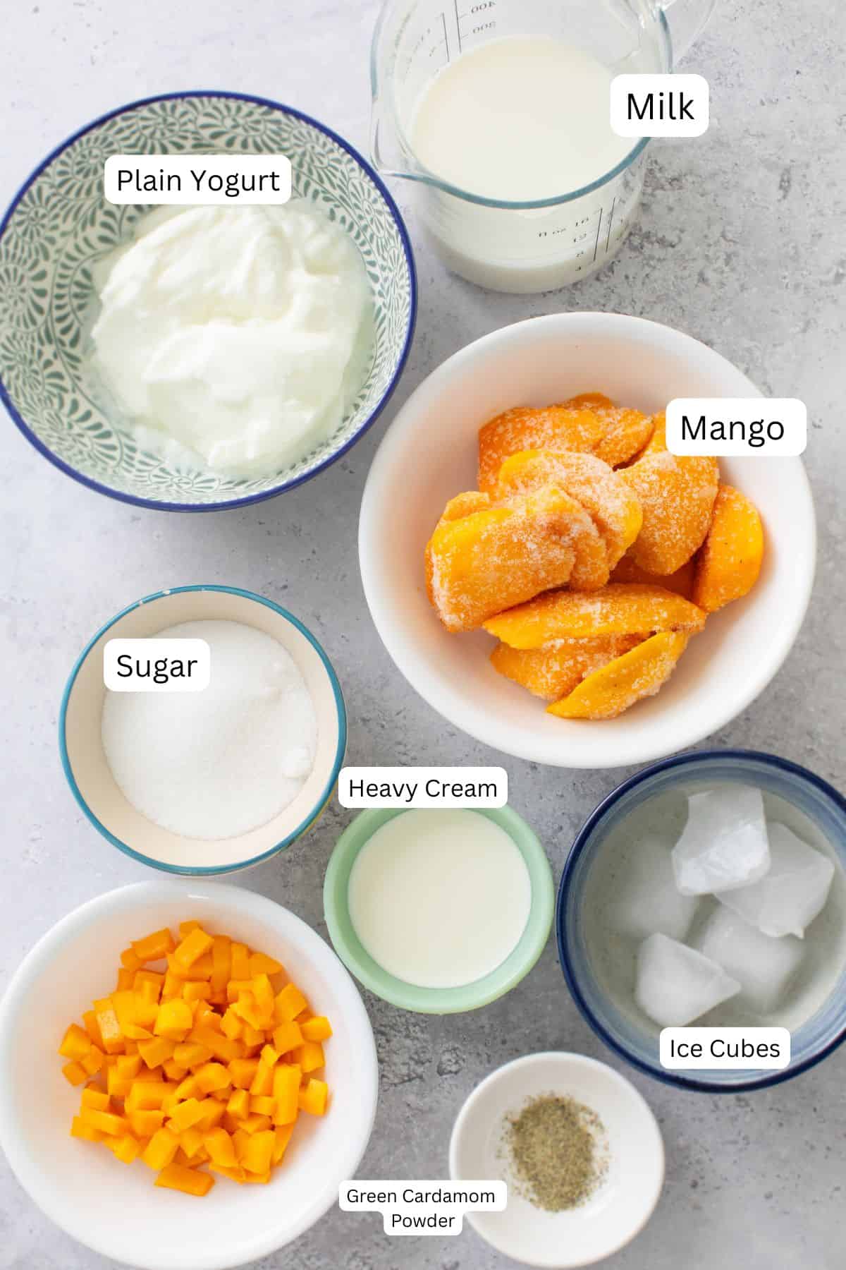 Ingredients needed to make mango lassi.
