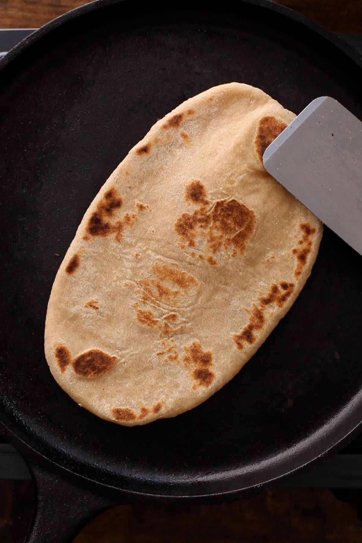 Atta naan is browned nicely on both sides.