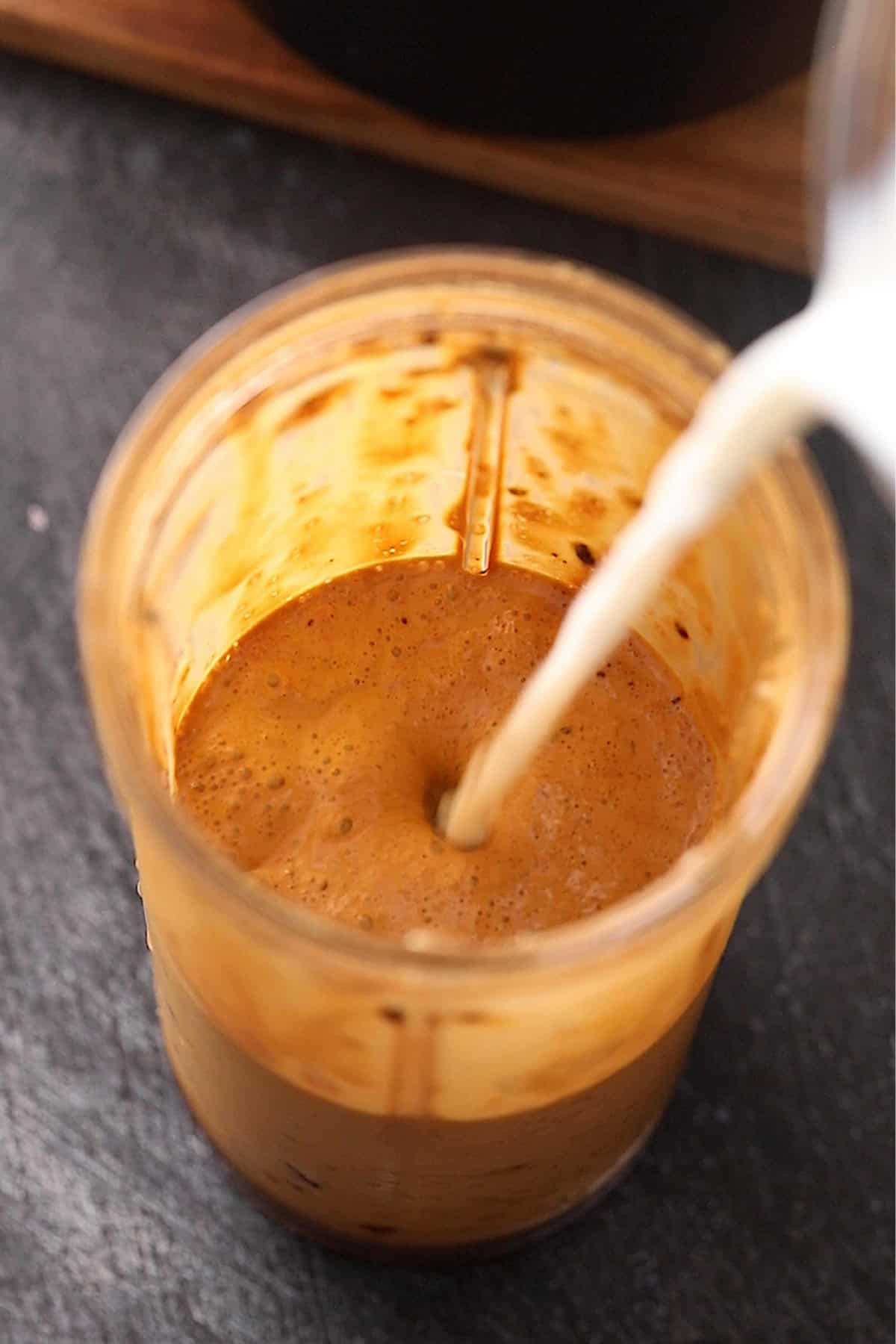 Milk is added to blended coffee.
