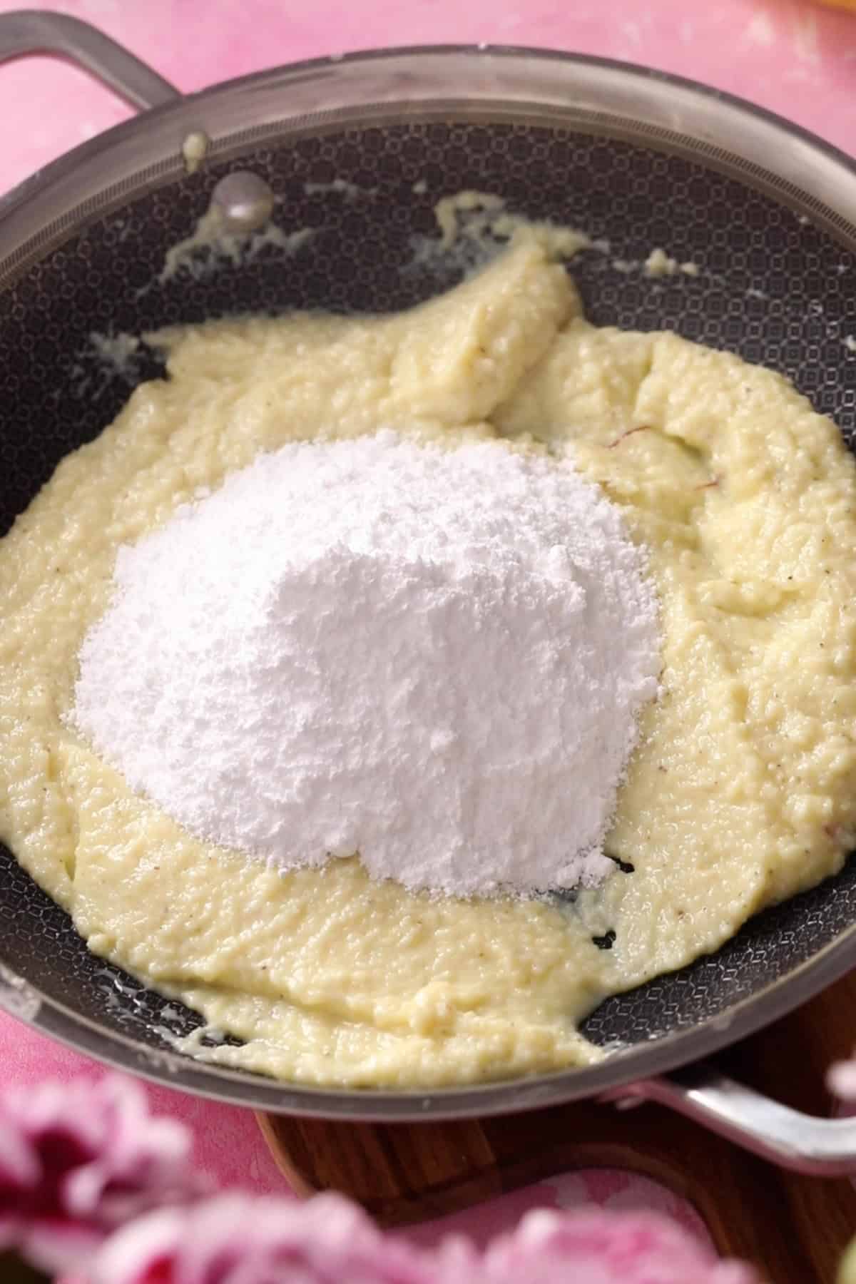 Powdered Sugar is added to softened khoya.
