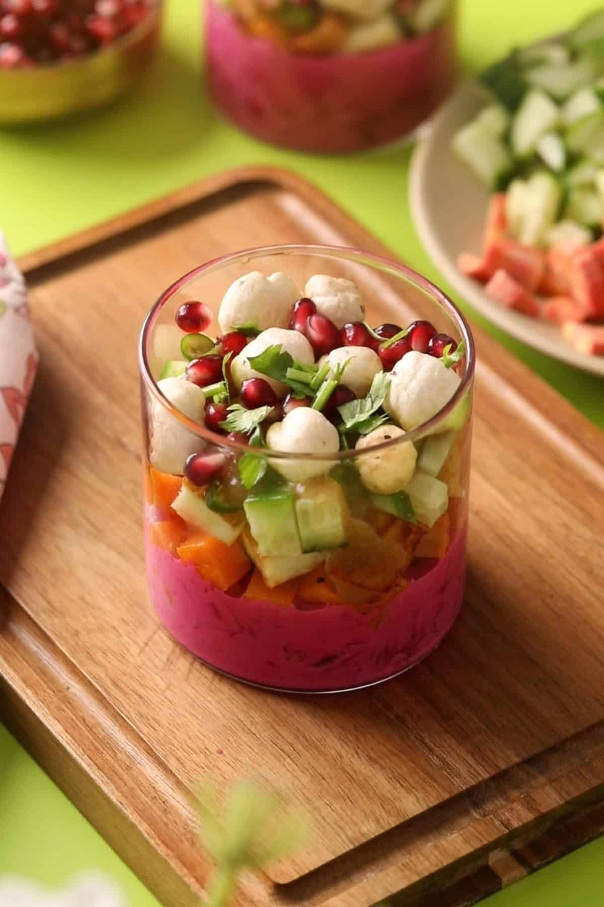 Pomegranate and fox nuts are added to the chaat cups.